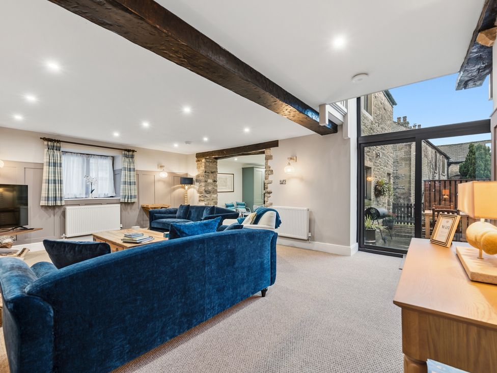 A living room with sofas and a coffee table at The Forge in Castleton, Peak District