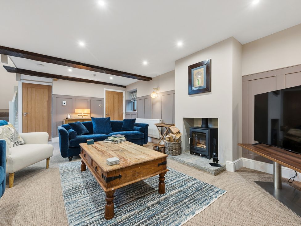 A living room with seating and a fireplace at The Forge in Castleton, Peak District