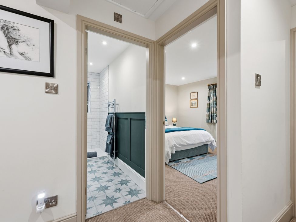 A hallway leading to a bathroom and bedroom at The Forge in Castleton, Peak District