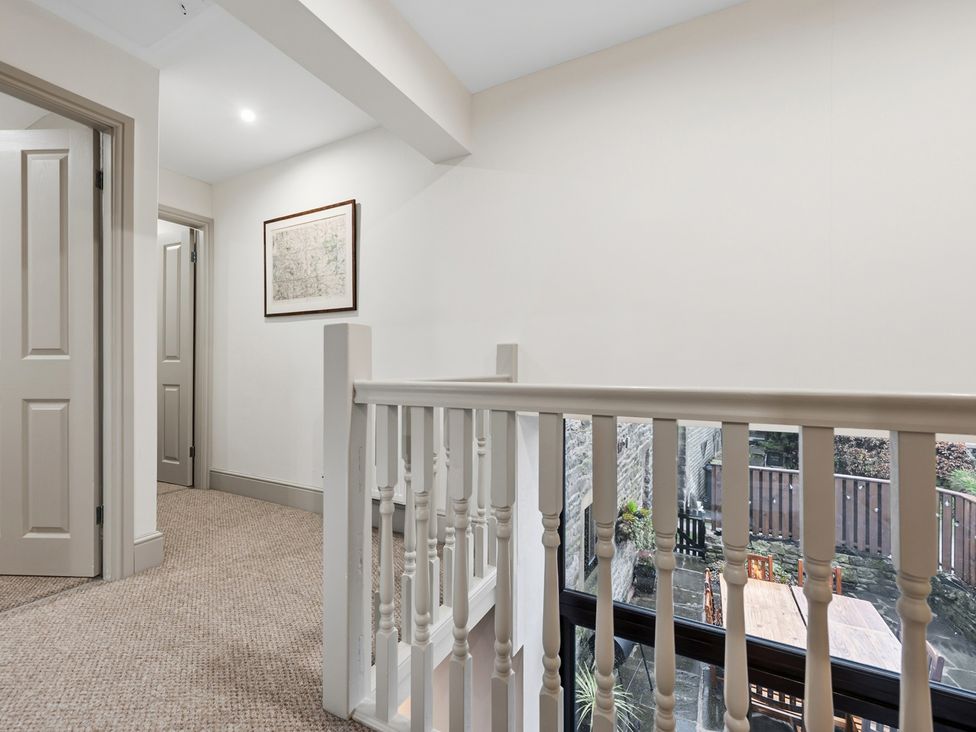 A hallway with doors and a picture at The Forge in Castleton, Peak District