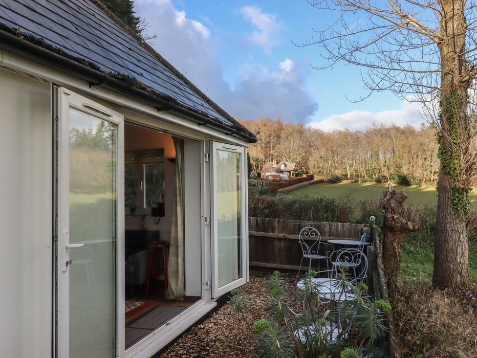 An outdoor area with chairs and a table at The Old Telephone Exchange in Exeter