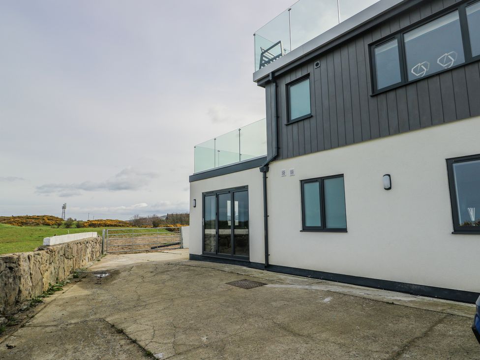 An outdoor area of a building with a gate at Pengarnedd Amlwch