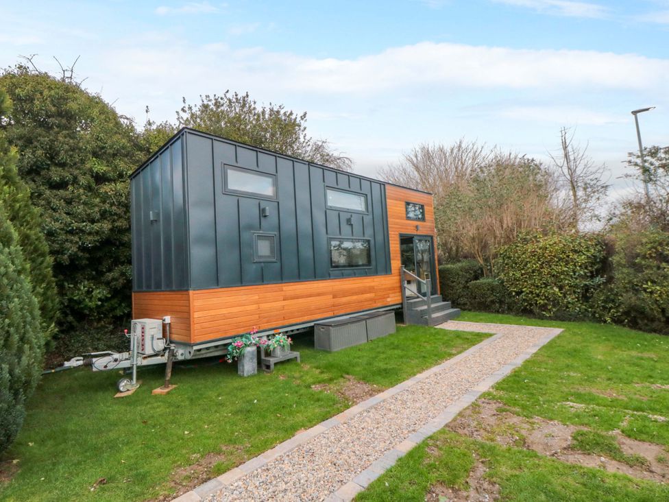 A tiny house with steps and garden at The Tiny Home in 