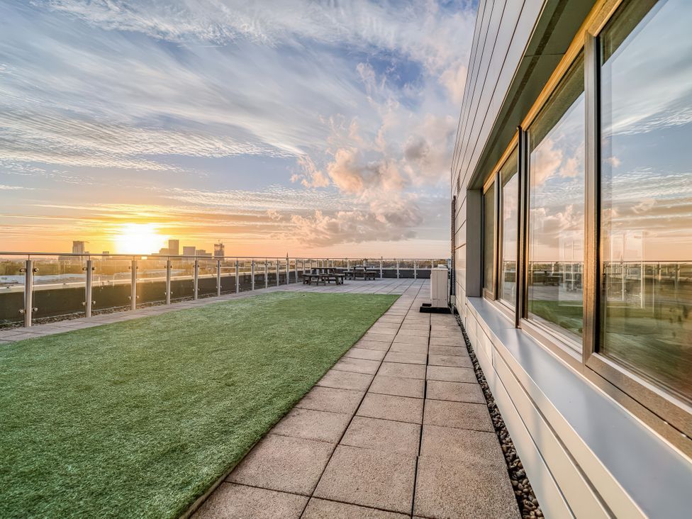 An outdoor area with a sunset view at Apartment 422 in Manchester