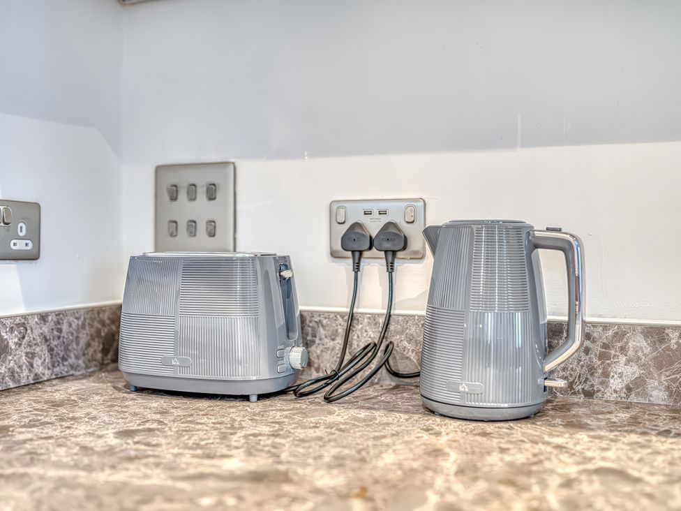 A toaster and kettle on the countertop at Apartment 422 in Manchester