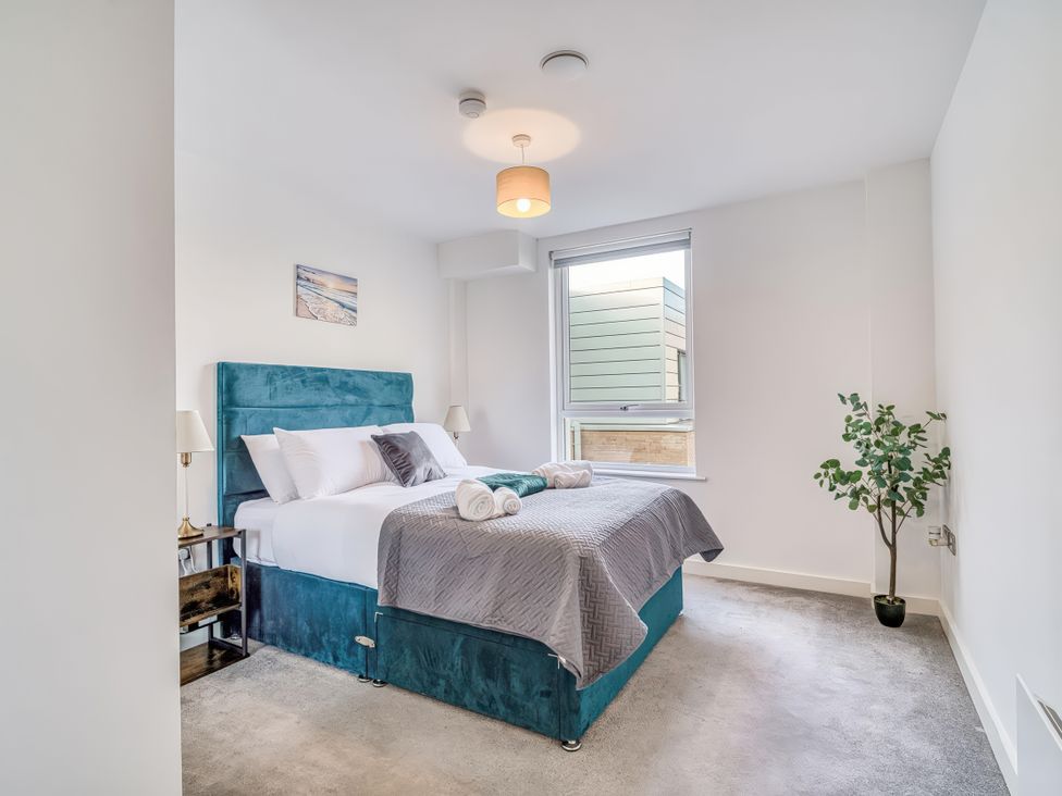 A bedroom with a bed and a window at Apartment 422 Manchester