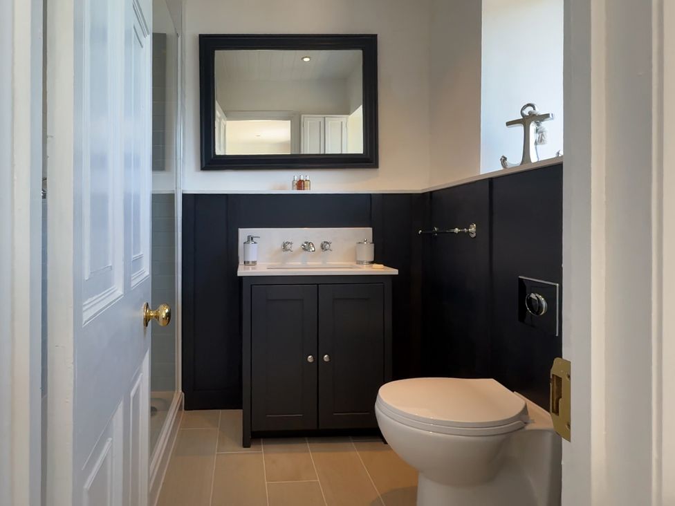 A bathroom with a sink and toilet at Bell Cottage in Dartmouth