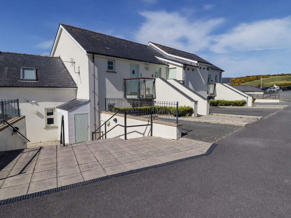 An outdoor area with buildings and a pathway at Ty Mor in Newport, Pembroke