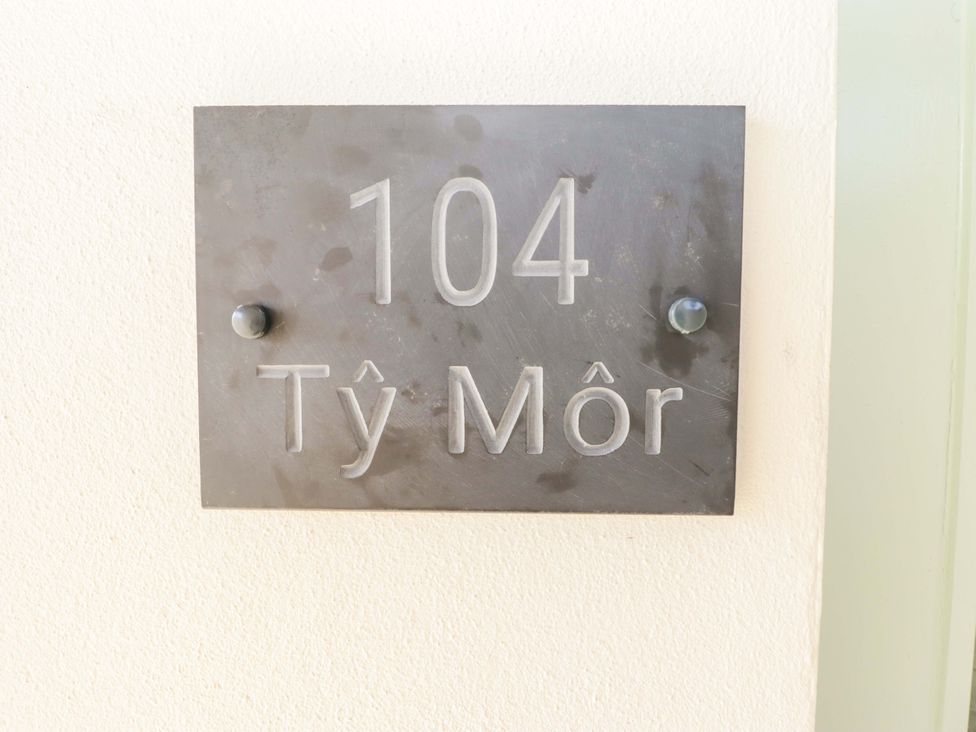 A house number sign 104 Ty Mor