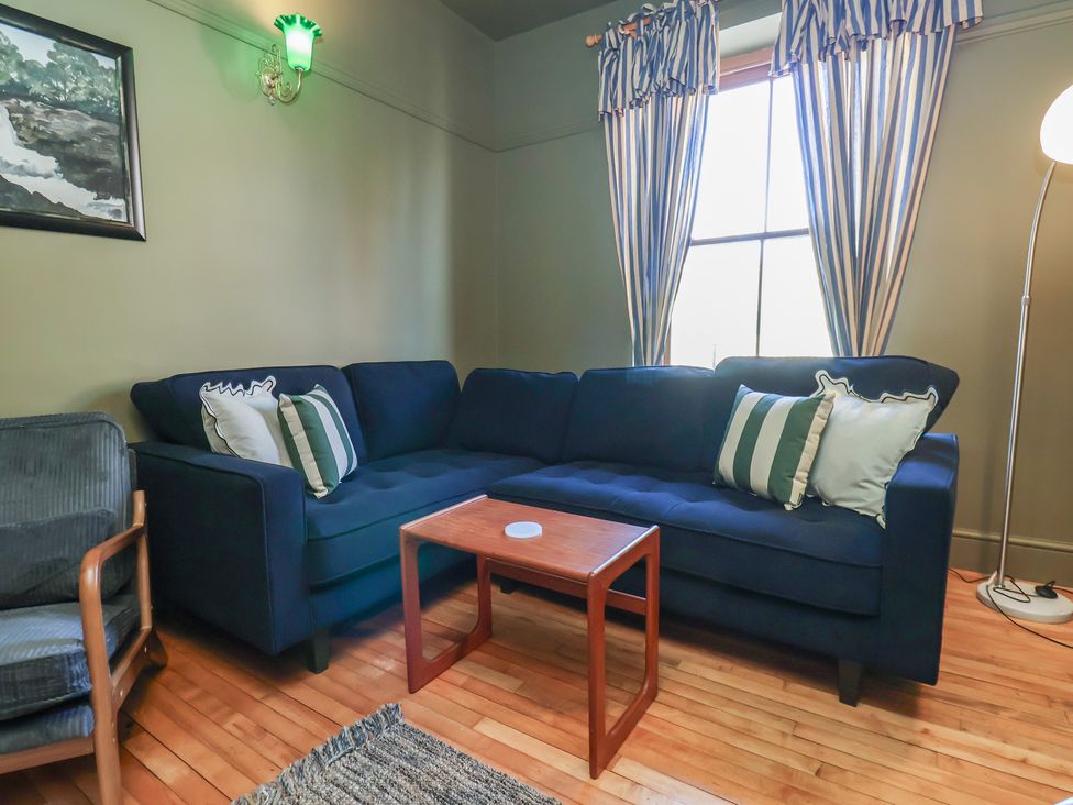 A living room with a sofa and coffee table at Mulgrave House in Hinderwell near Staithes