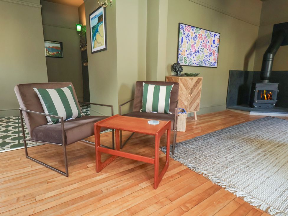 A living room with chairs and a table at Mulgrave House Hinderwell near Staithes