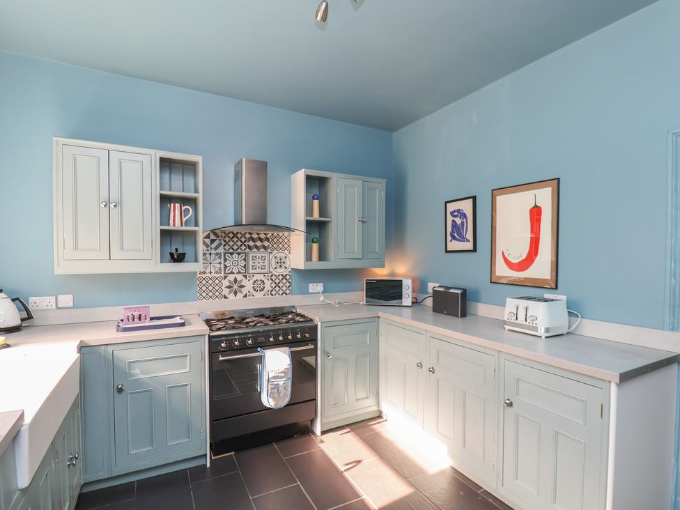 A kitchen with cabinets and appliances at Mulgrave House in Hinderwell near Staithes