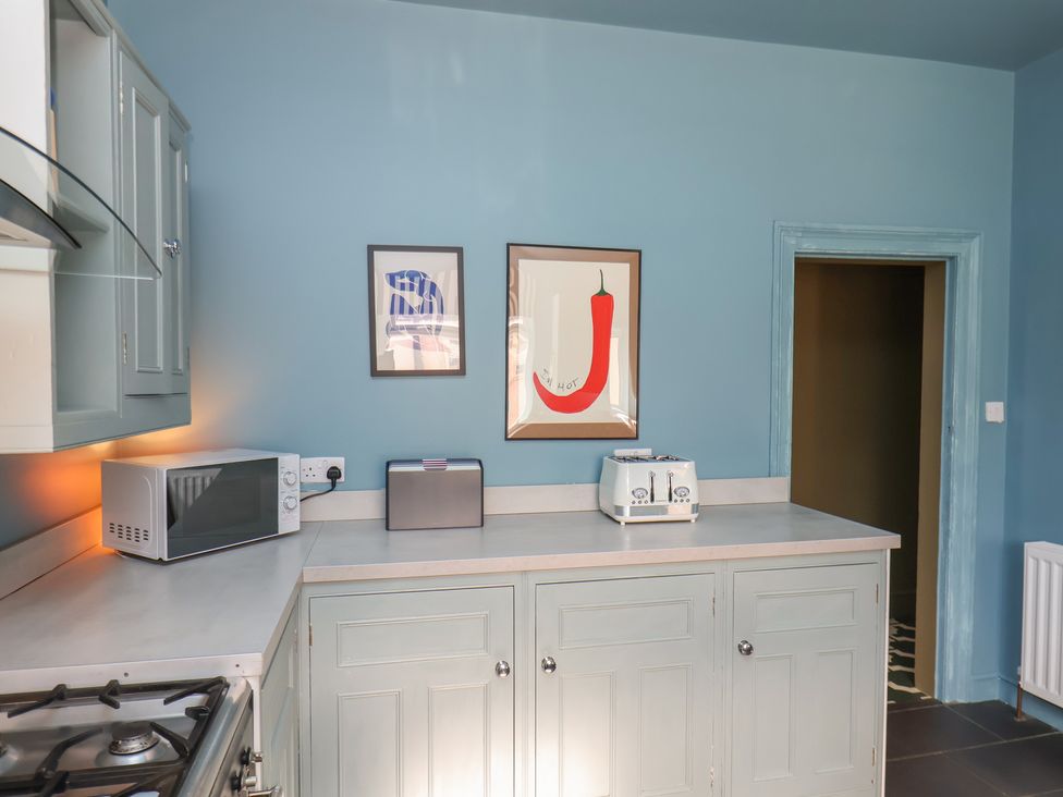 A kitchen with a microwave and toaster at Mulgrave House in Hinderwell near Staithes