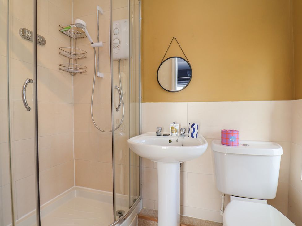 A bathroom with a shower and sink at Mulgrave House in Hinderwell near Staithes