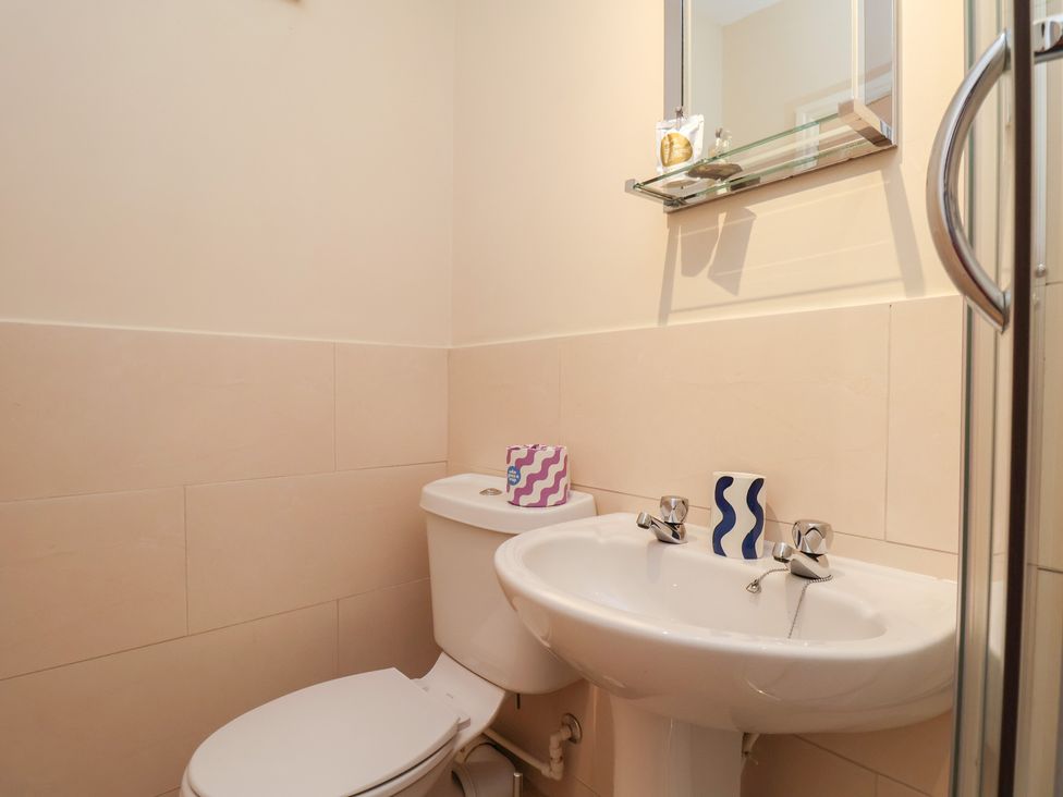A bathroom with a toilet and sink at Mulgrave House in Hinderwell near Staithes