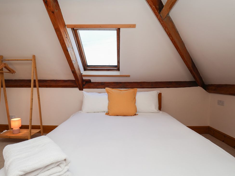 A bedroom with a bed and window at Mulgrave House Hinderwell near Staithes