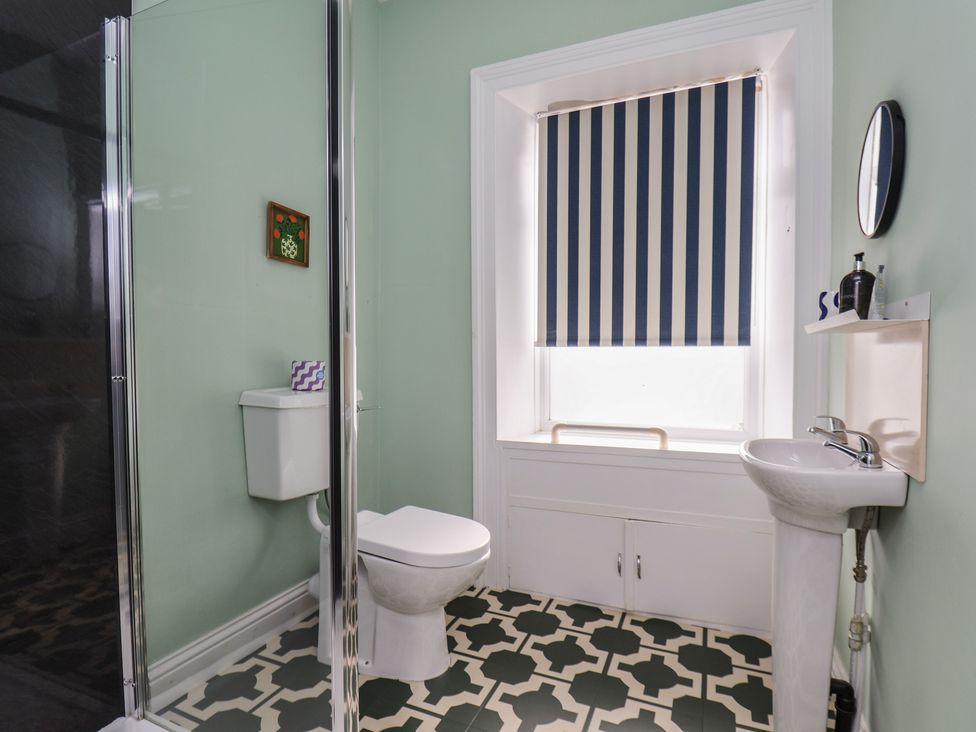 A bathroom with shower, toilet, and sink at Mulgrave House Hinderwell near Staithes