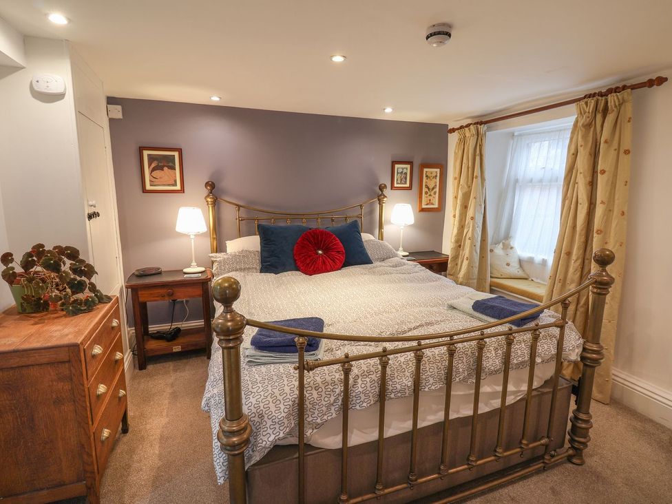 A bedroom with a bed and nightstand at Apartment at Mulgrave House Saltburn-by-the-Sea