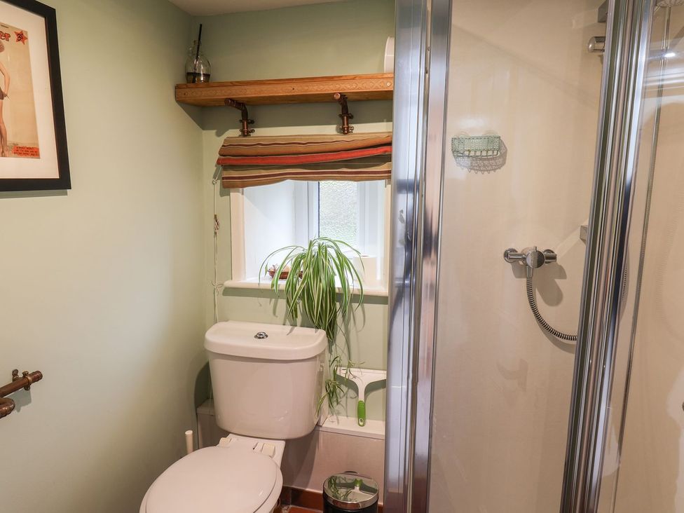 A bathroom with a toilet and shower at Apartment at Mulgrave House, Saltburn-by-the-Sea