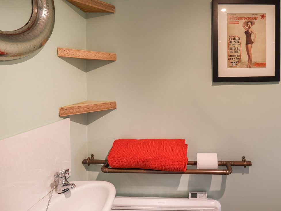A bathroom with a sink and towel rack at Apartment at Mulgrave House in Saltburn-by-the-Sea