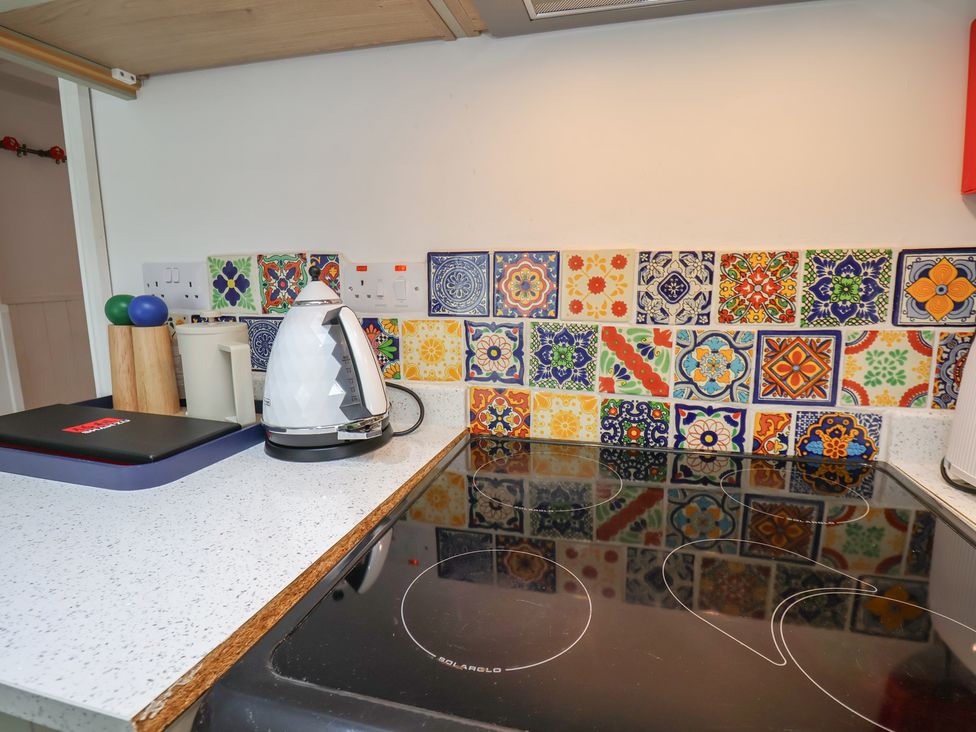 A kitchen with a kettle and an induction cooktop at Apartment at Mulgrave House Hinderwell near Staithes