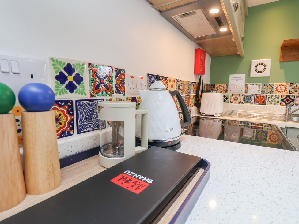A kitchen with a kettle and coffee maker at Apartment at Mulgrave House Hinderwell near Staithes