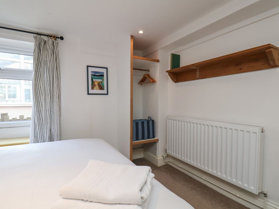 A bedroom with a bed and storage space at Apartment at Mulgrave House Hinderwell near Staithes