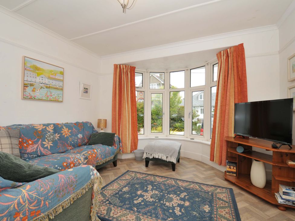 A living room with a sofa and television at Porthmeor in Wadebridge