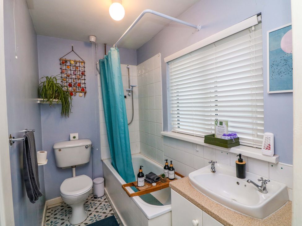 A bathroom with a shower and bathtub at Long Jack's in Ballygarrett, County Wexford