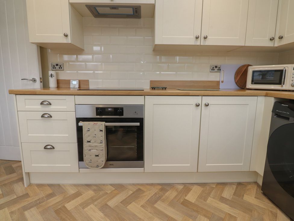 A kitchen with an oven and microwave at Wardenlea Preston
