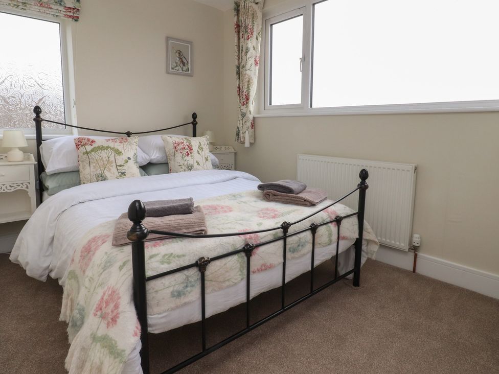 A bedroom with a bed and bedside table at Wardenlea Preston