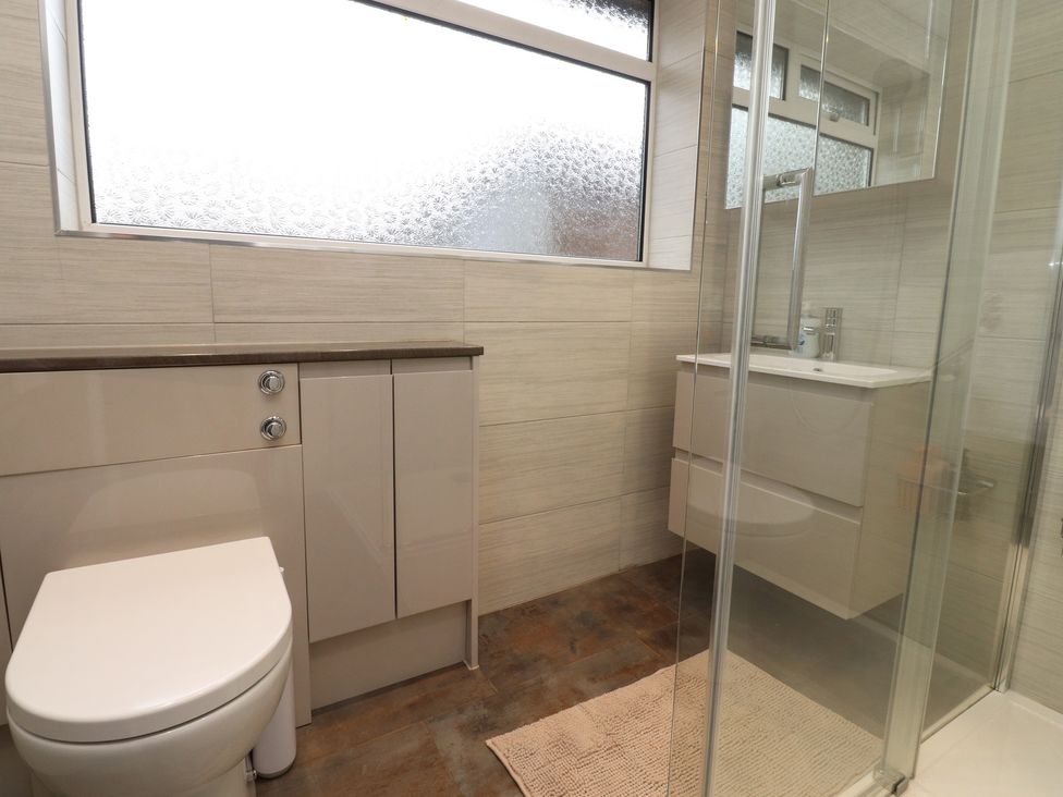 A bathroom with a sink and shower at Wardenlea in Preston