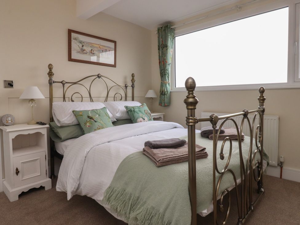 A bedroom with a bed and bedside table at Wardenlea in Preston