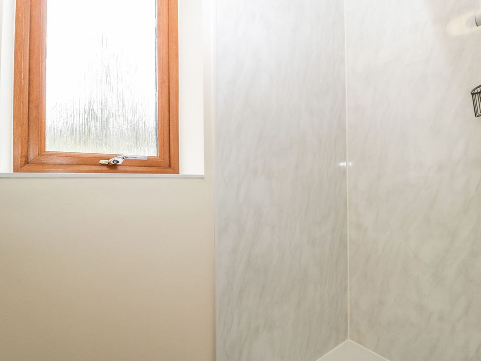A shower with a window at Orchard Cottage in Ledbury
