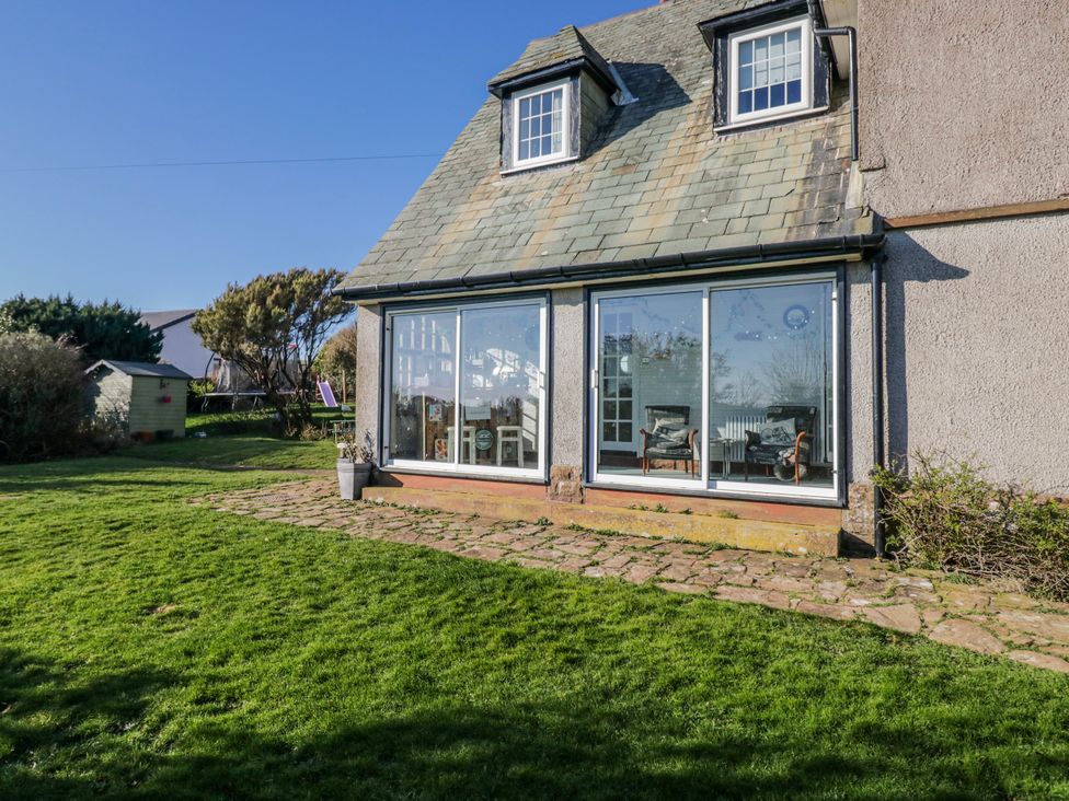 A house with a garden and large windows at Somerby St Bees
