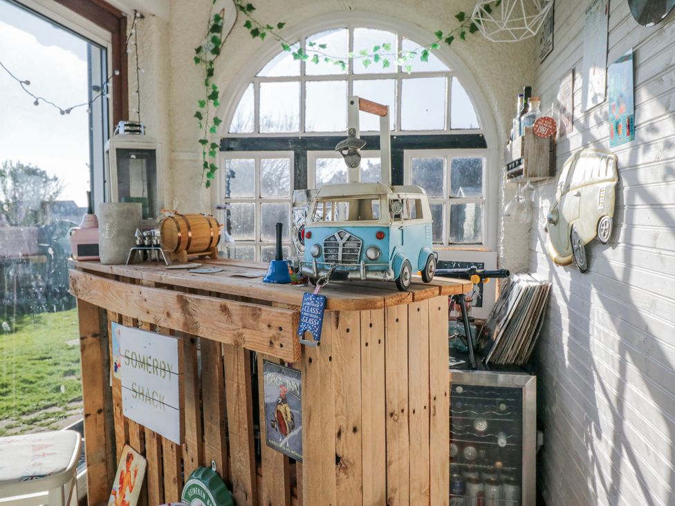 A conservatory with a bar and a model van at Somerby in St Bees