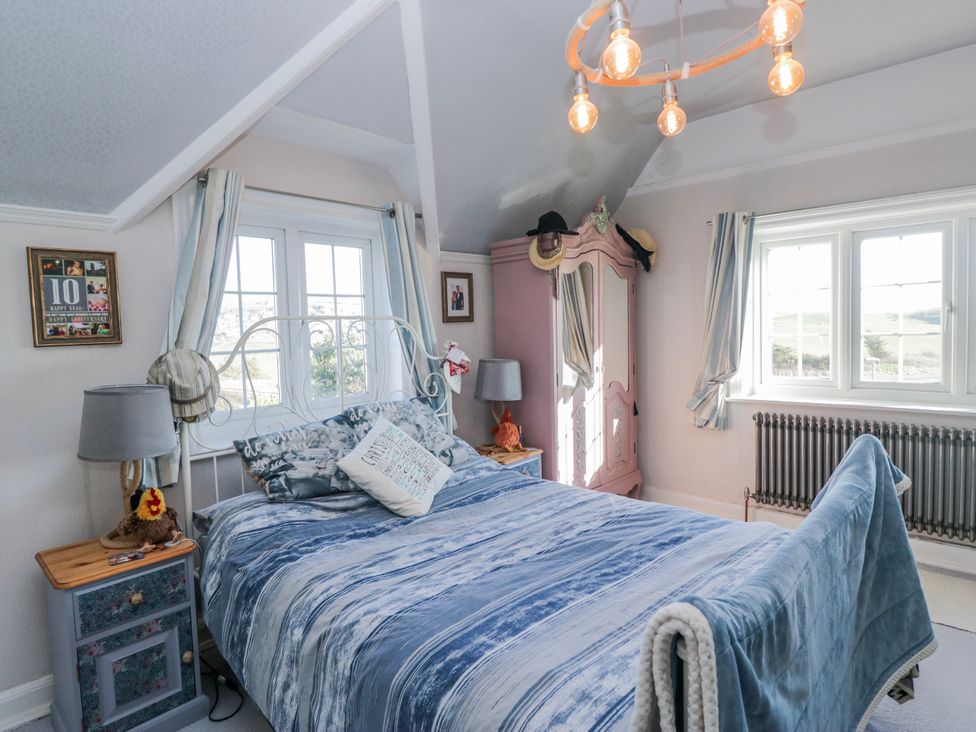 A bedroom with a bed and bedside table at Somerby in St Bees