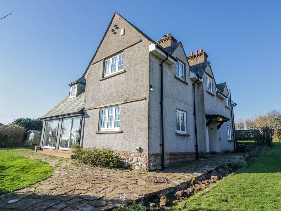 A house with a stone pathway and garden at Somerby in St Bees
