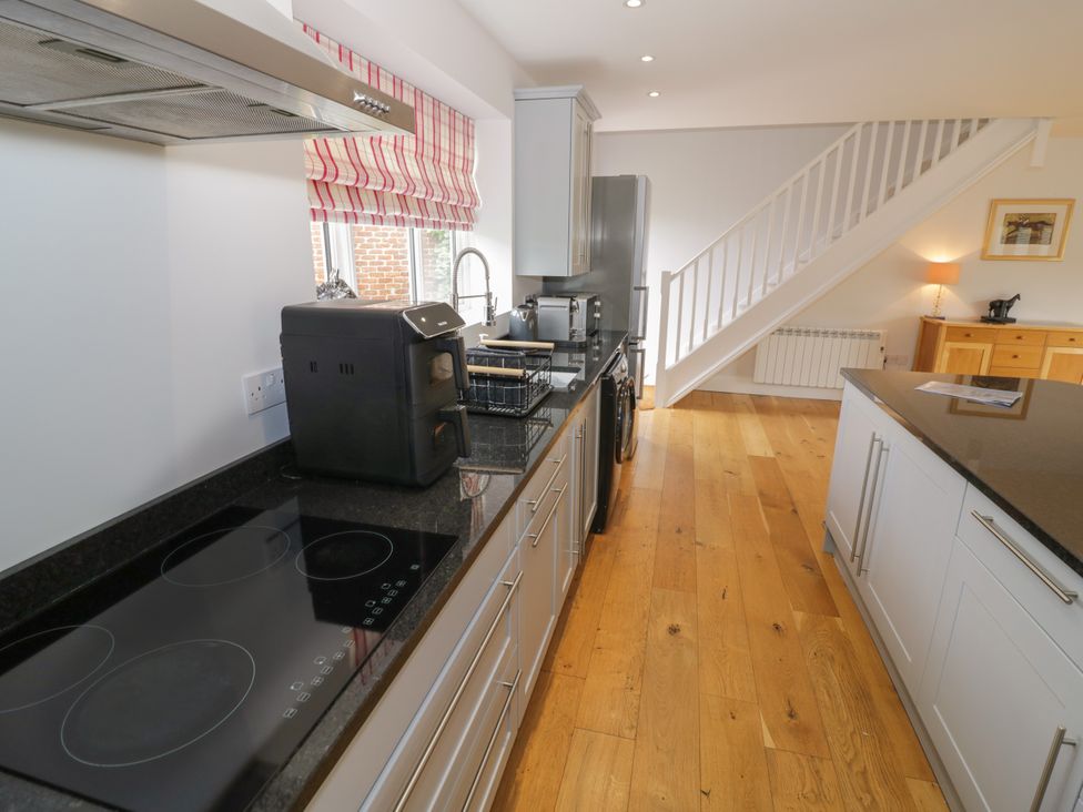 A kitchen with an oven and refrigerator at Underhill House Annex Stratford-Upon-Avon