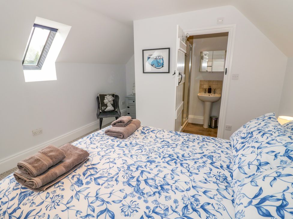 A bedroom with a bed and an en-suite bathroom at Underhill House Annex Stratford-Upon-Avon
