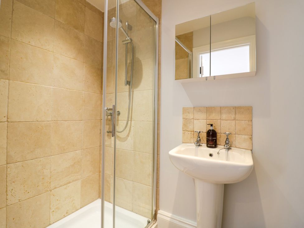 A bathroom with a shower and sink at Underhill House Annex Stratford-Upon-Avon