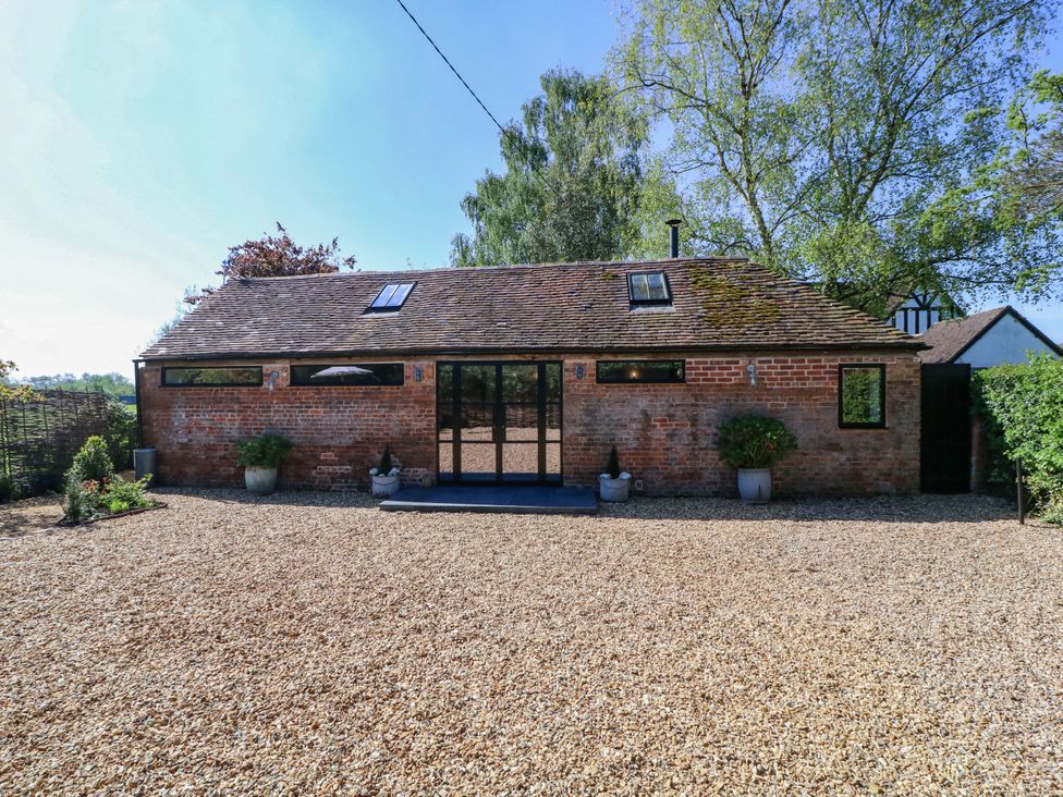 An outdoor view of a house with gravel in front at The Barn in 