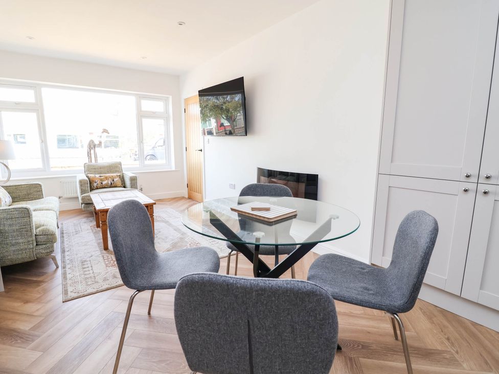 A living room with a sofa and television at 6 Bastion Close Prestatyn