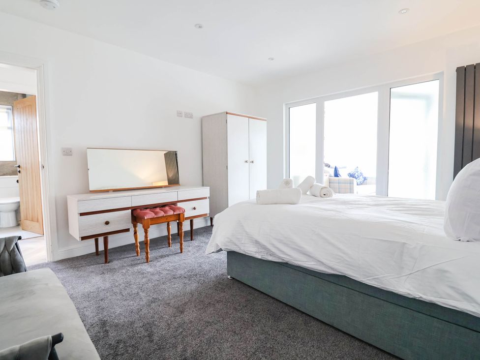 A bedroom with a bed and furniture at 6 Bastion Close Prestatyn