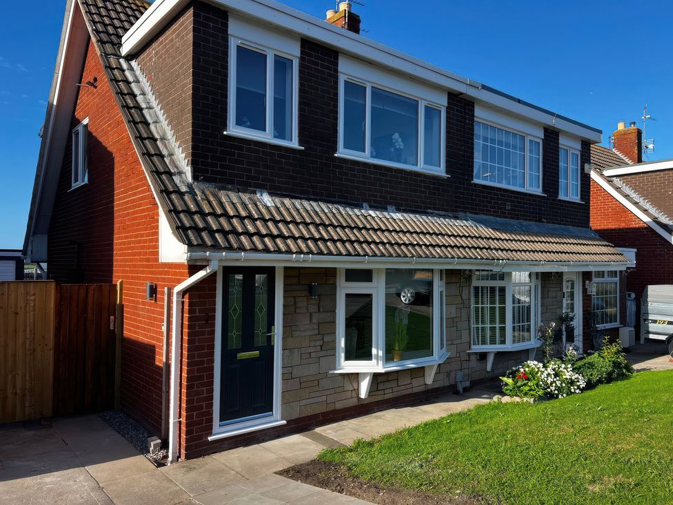 A house with a garden and pathway at 21 Bastion Gardens in Prestatyn