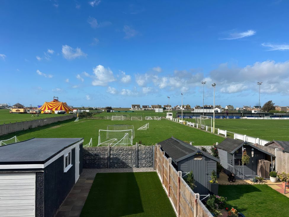 An outdoor view of a football pitch and circus tent at 21 Bastion Gardens Prestatyn