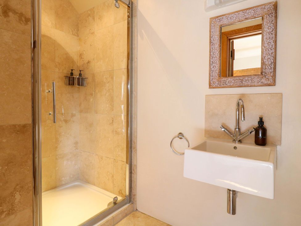 A bathroom with a shower and sink at Six Apples in Wethersfield near Finchingfield
