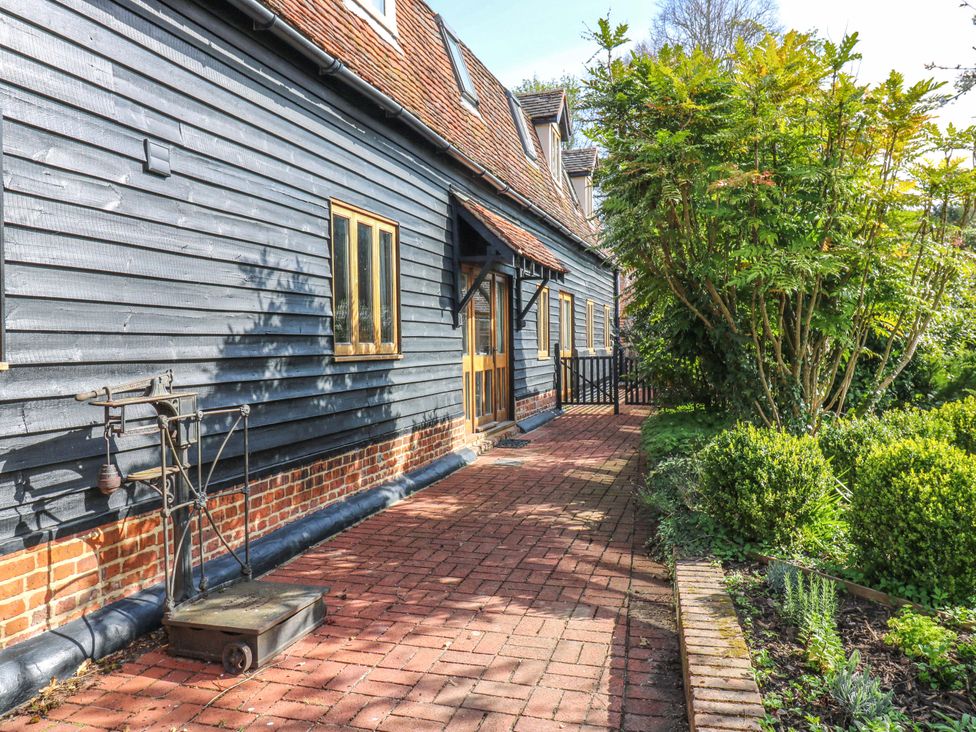 An outdoor view of a pathway leading to a house at Six Apples in Wethersfield near Finchingfield