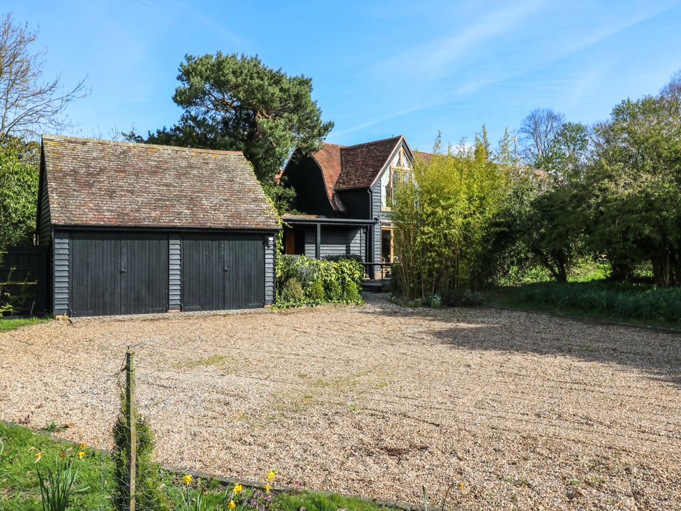 A house with a garage and gravel area at Six Apples in Wethersfield near Finchingfield