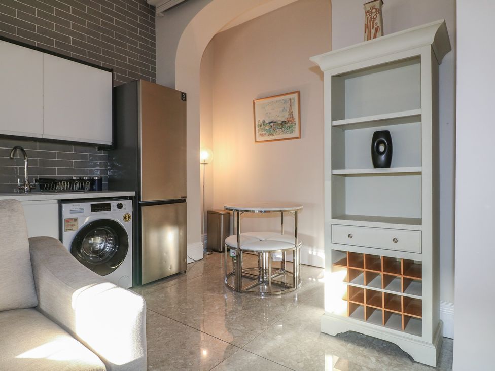 A kitchen with a washing machine and refrigerator at Unit 6 Apt 3 in Sheffield